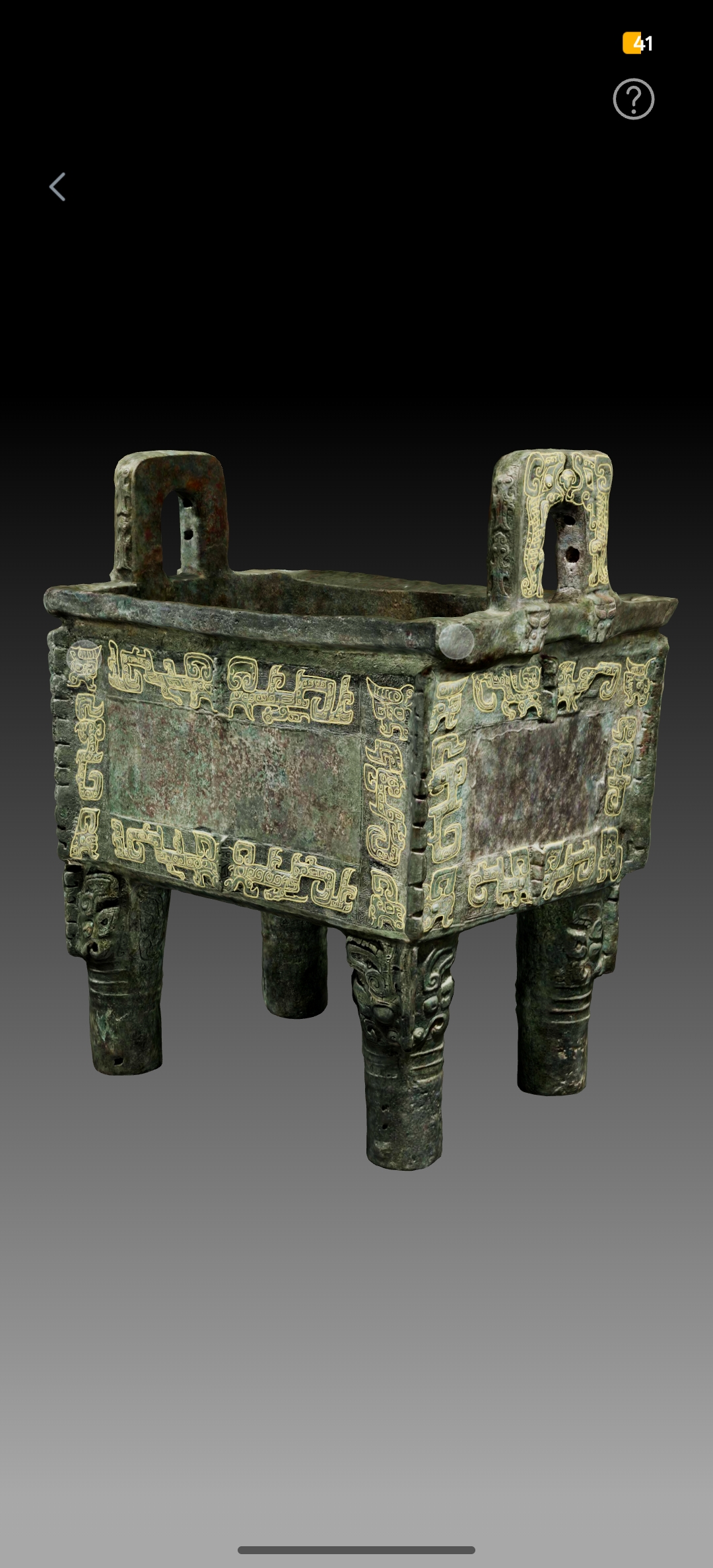 古代青铜鼎，三足双耳造型，表面有精美的云雷纹装饰，青铜色古朴厚重，背景为深色展厅环境